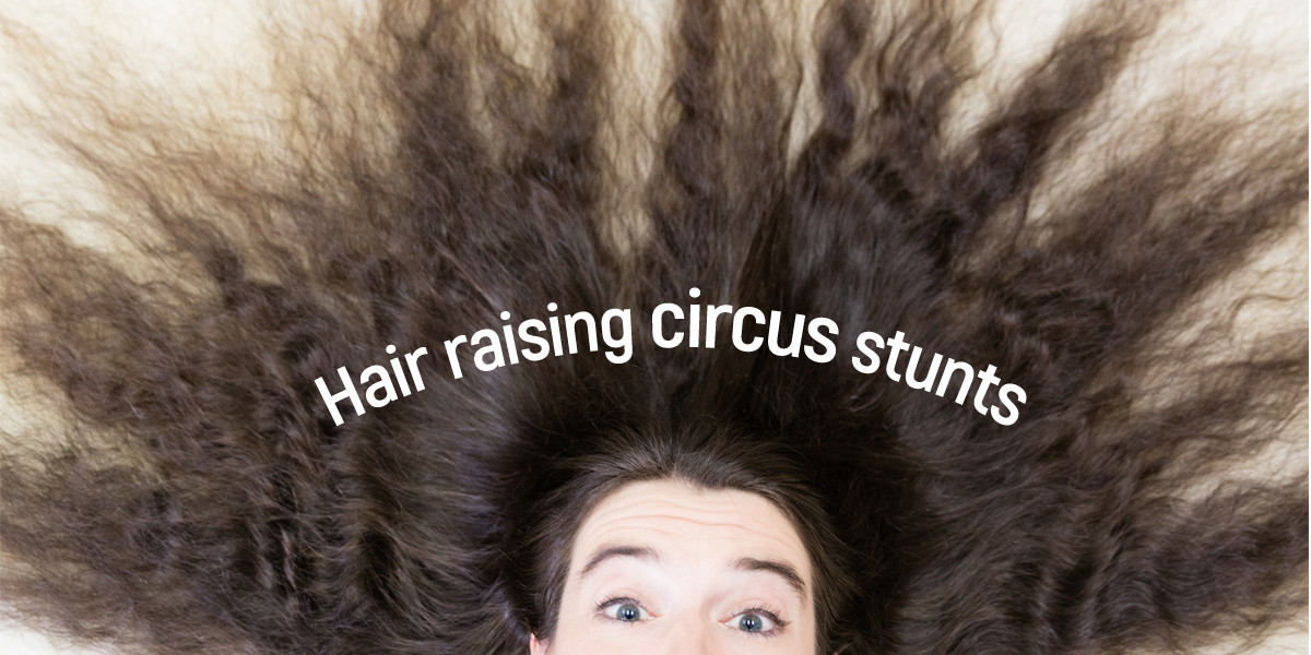 Wavy brown hair fills the image. Two eyes and the top of a face are just visible at the bottom. text reads Hair raising circus stunts.