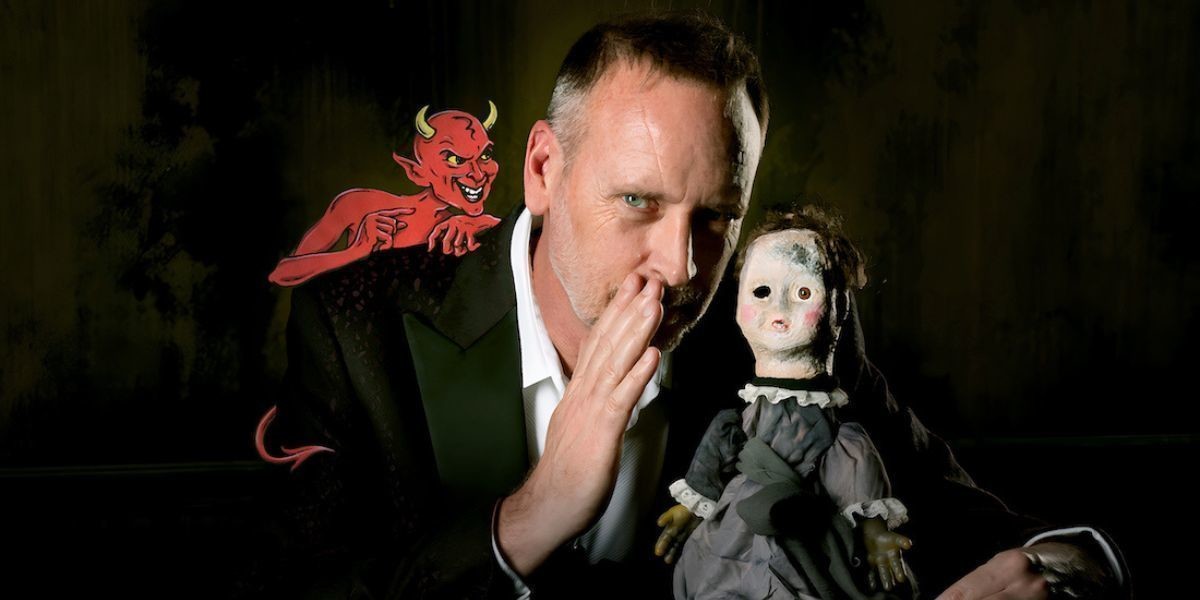 Man whispering into spooky doll's ear with a devil on his shoulder.