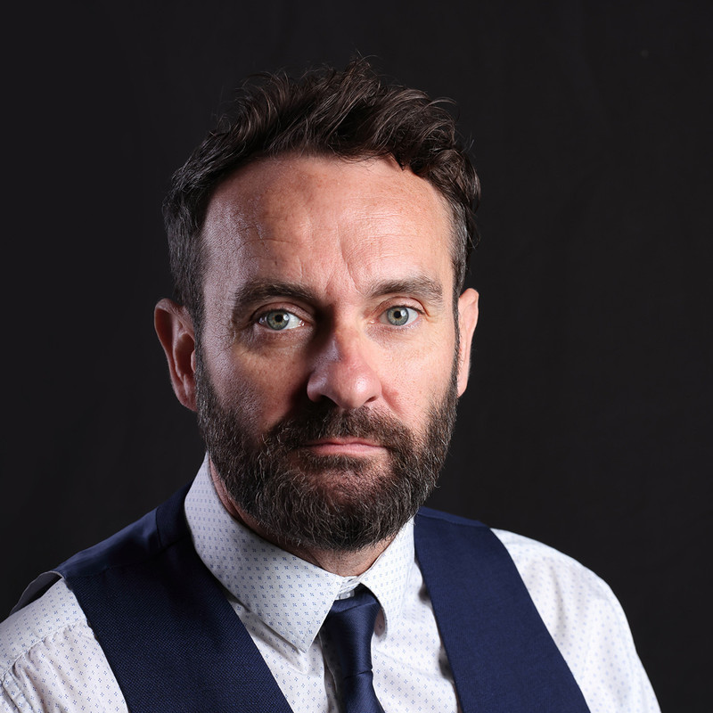 In a smart waistcoat and tie our hero, a handsome bearded middle aged man stares in a melancholy manner into the lens