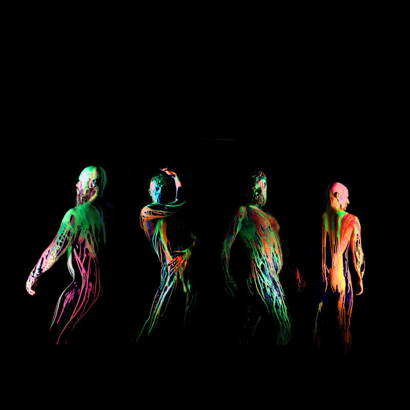 Moist - Four men covered in neon paint
