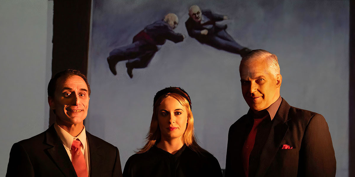 Nick Bennett, Sophie Hollingworth, Dominique Sweeney with flying bald-headed men painted by Chris Orchard. Image: Lee Hopkins