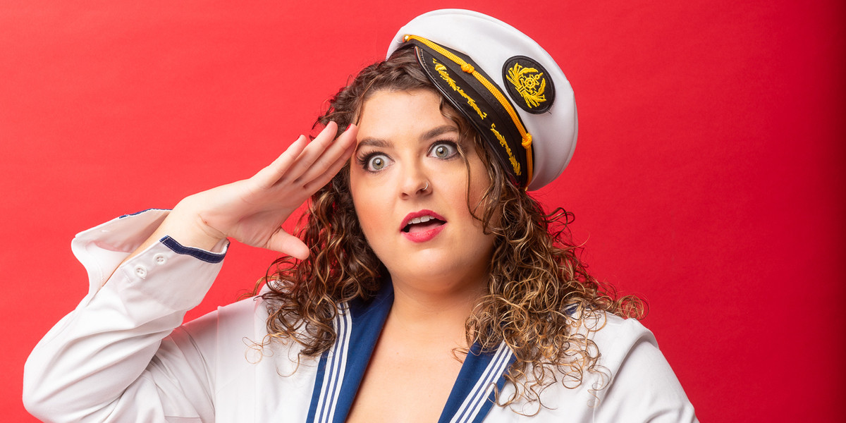 A woman with a vacant stare does a sailor salute.