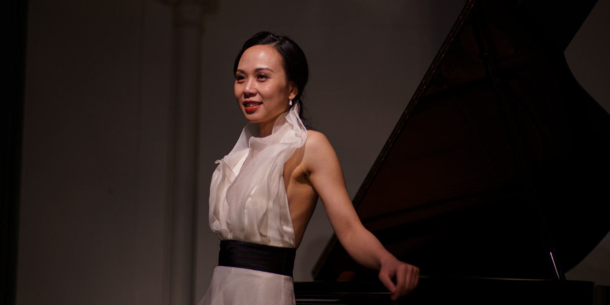 Janice Tan's profile image. She was standing next to a grand piano.