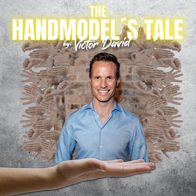 The Handmodel's Tale by Victor David. Victor David in a blue shirt, against a brick wall, served by a model hand.