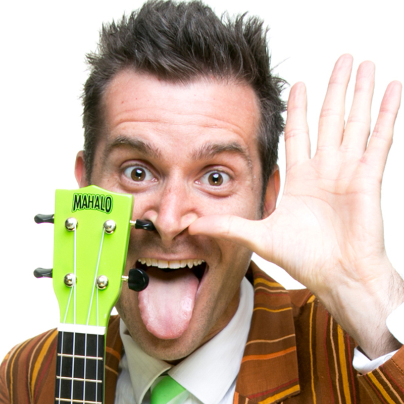 funny, gross man poking his tongue out while his guitar is stuck up his nose