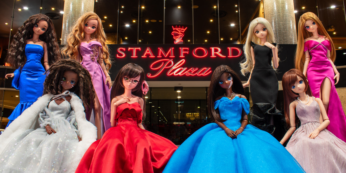 All eight Smart Dolls, dressed in their Gala Charity Ball gowns, posing out the front of Stamford Plaza Adelaide.