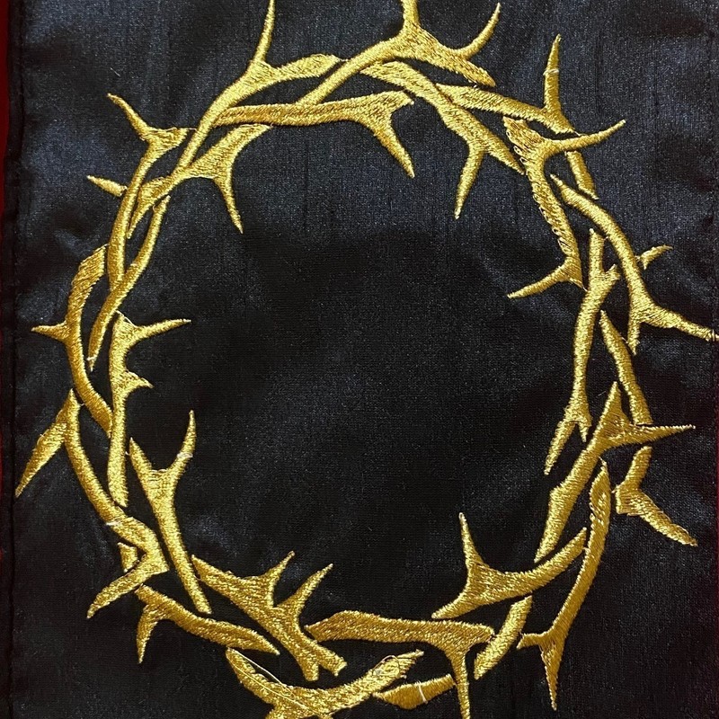 Marvellous Music at Mary Mags - Image of a gold embroidered crown of thorns on a black background