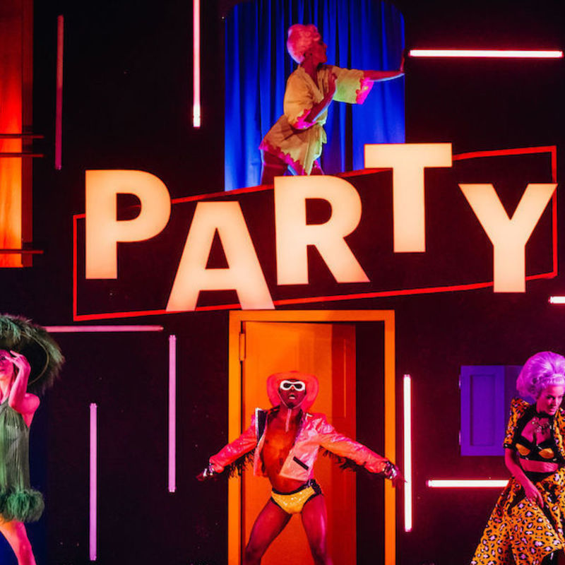 The cast of The Party pose across the set