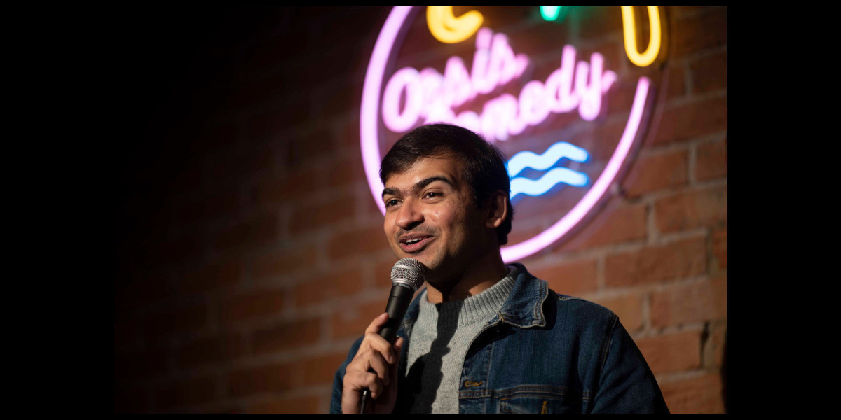 Shash performing at the Oasis Comedy Club