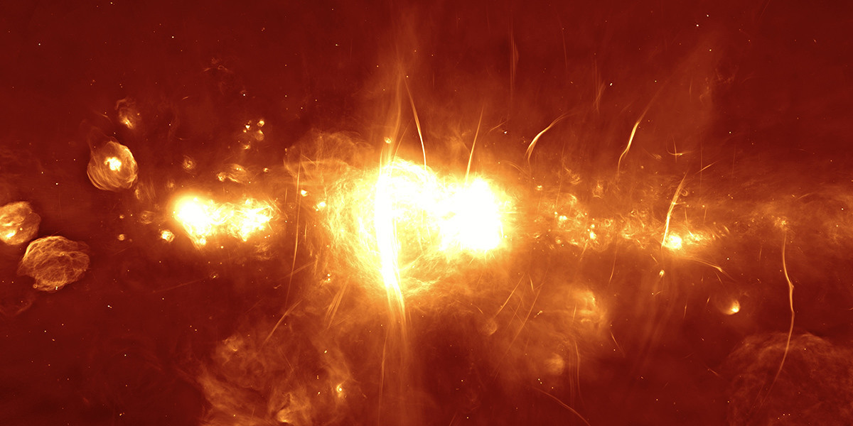 An image of a bright yellow flame and explosion in the middle. The background is orange.