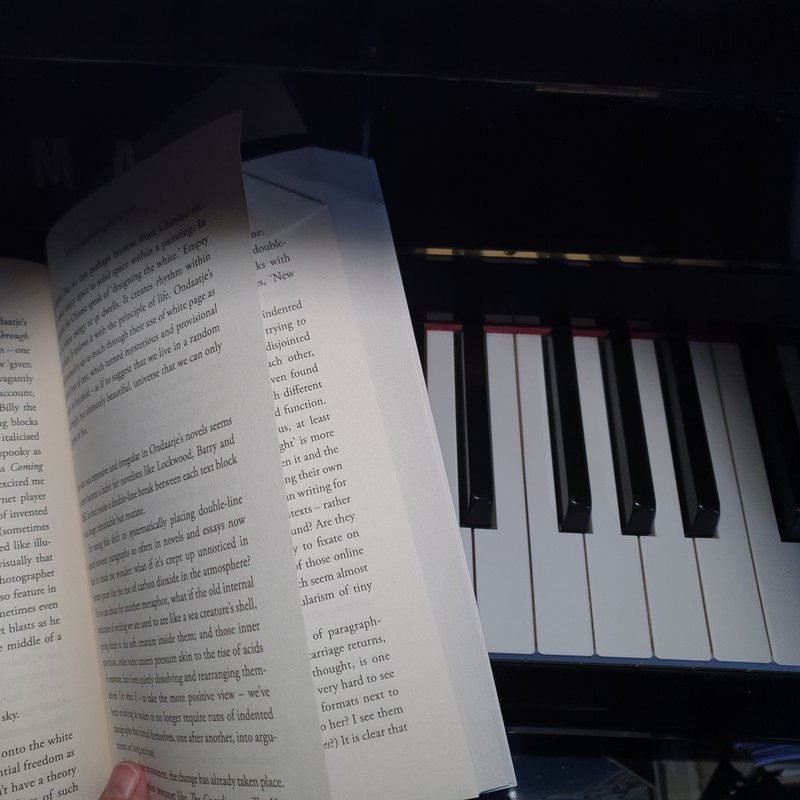 Turning The Page - An open book on a piano
