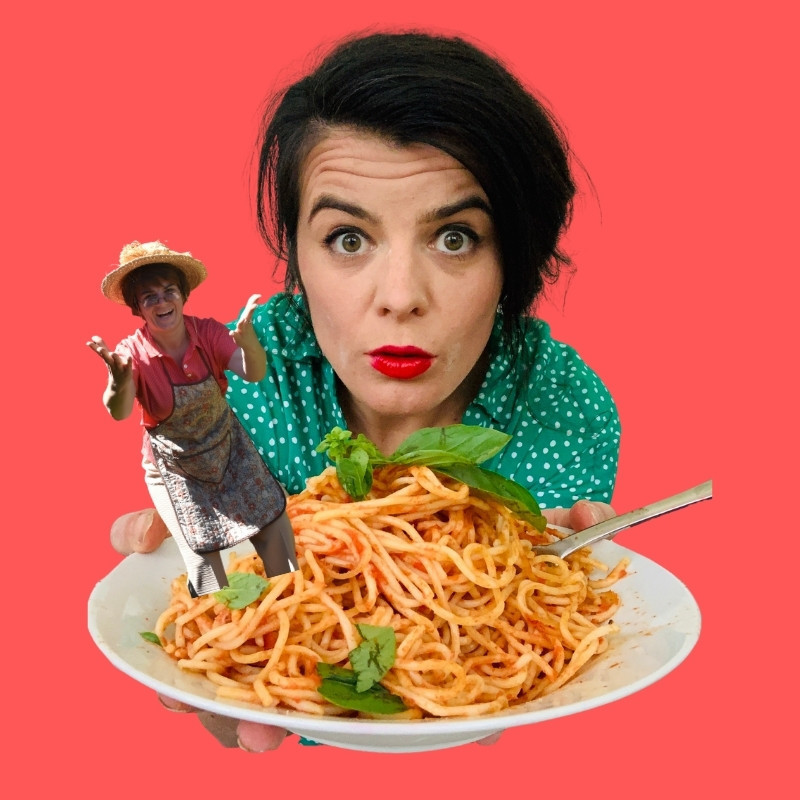 A woman holding a big bowl of spaghetti out in front with an old woman in an apron and hat jutting out.