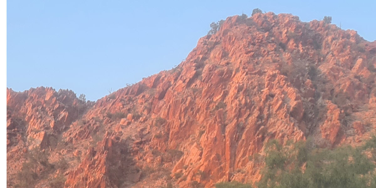 Umami at the Barossa Regional Gallery - Rock ridge near Alice Springs glowing red at sunrise