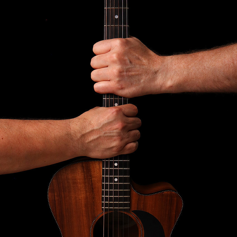 Soul Trader with two hand holding one guitar