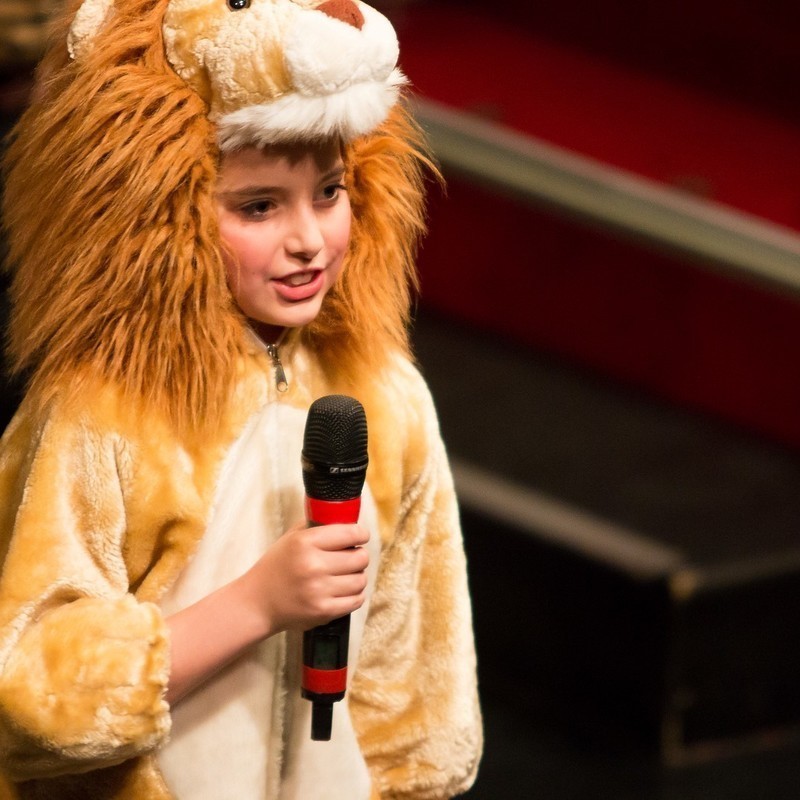 Broadway Bootcamp Showcase - Child singing in lion costume