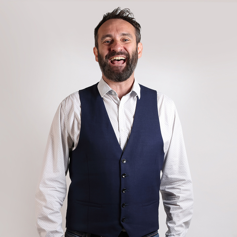Laughing in a waistcoat.