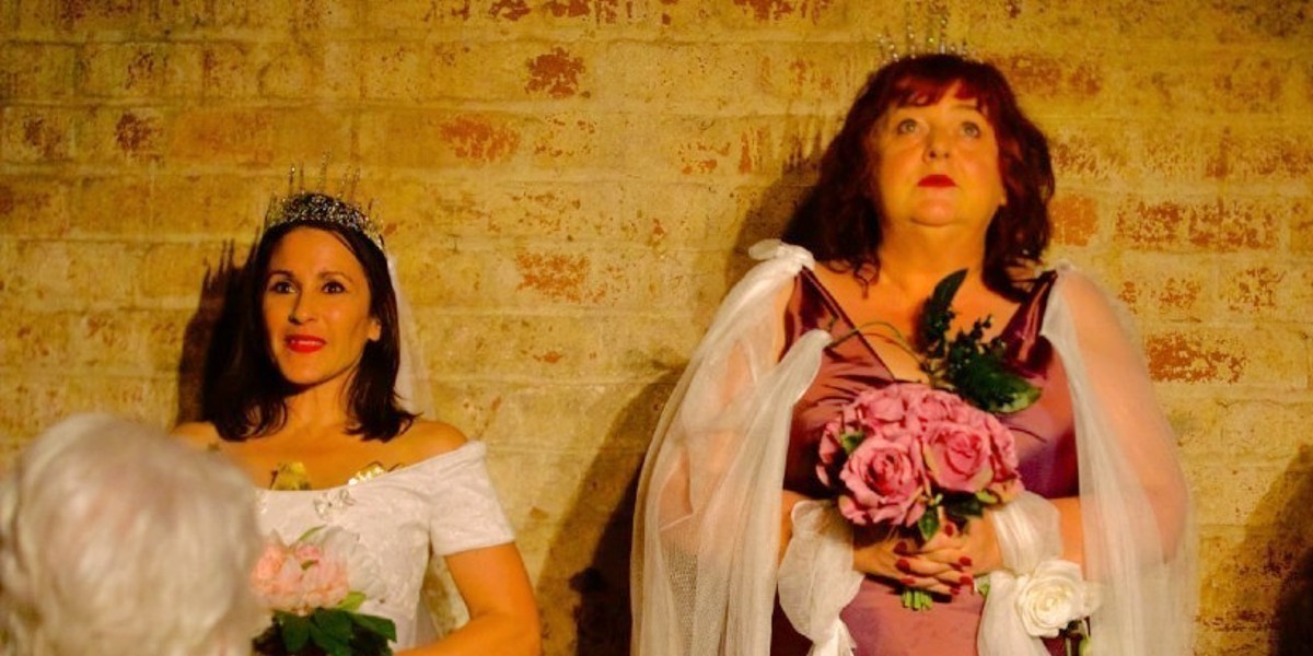 Two women standing in bridal wear