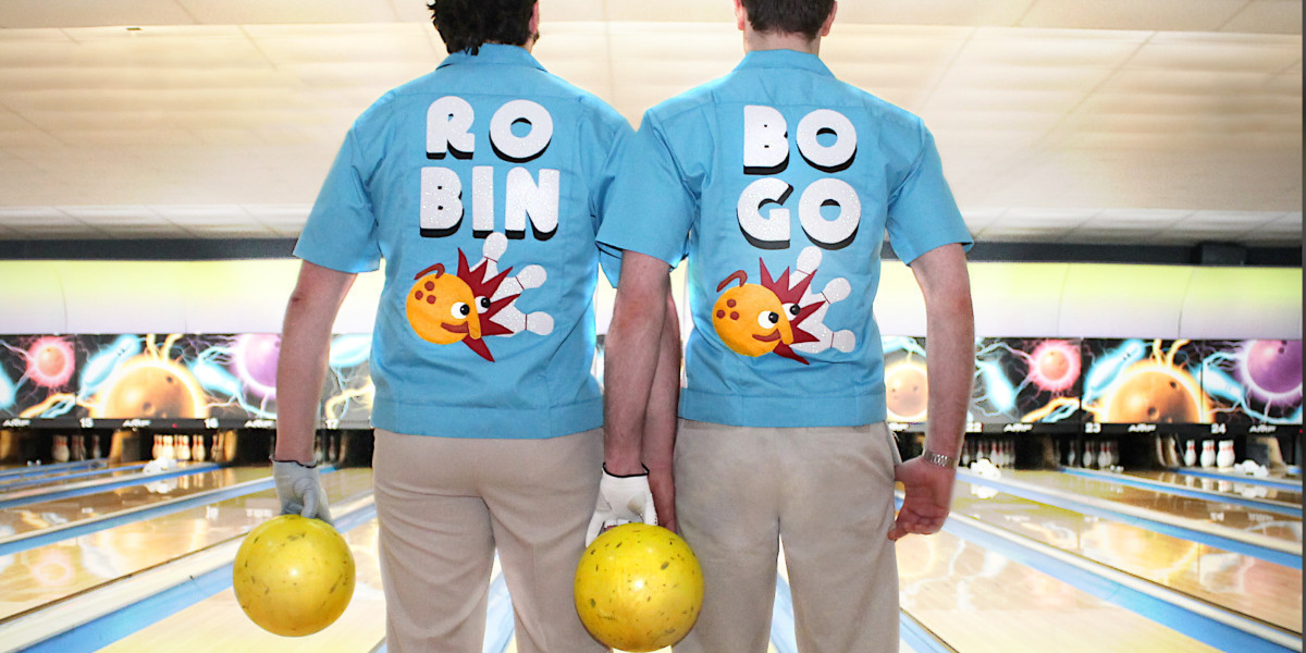 Pete and Lloyd holding wearing bowling shirts that say "Robo Bingo"