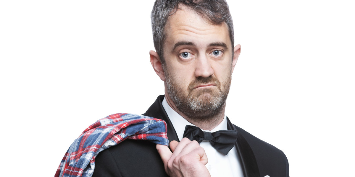 man in tuxedo look suave with flannel shirt thrown over shoulder