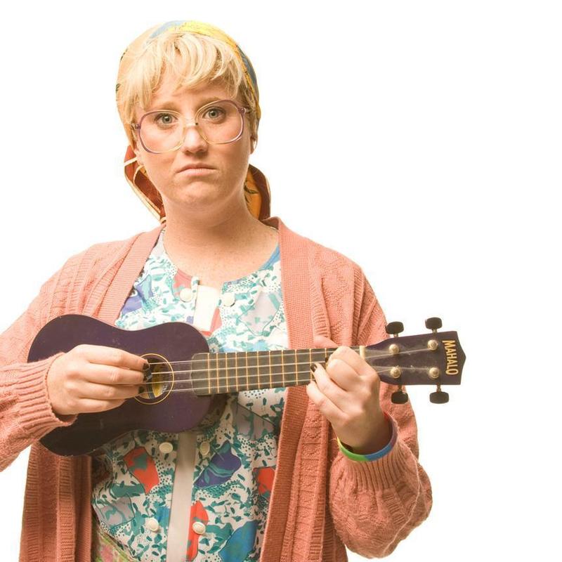 Granny Flaps holding ukulele looking serious