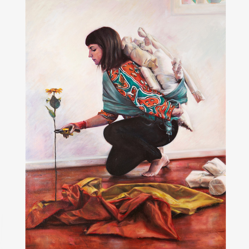'Bundled Together' by Jess Mara - An oil painting of a woman with shoulder length brown hair and a fringe, she crouched with one knee resting on the ground and is slightly leaning forward toward a single yellow flower.  In her right hand, the woman holds yellow garden secateurs poised around the stem of the flower. The woman is carrying numerous packages on her back. Each package is wrapped in pale coloured cloth or paper and is tied up with string. In the foreground rests red and orange fabric with numerous folds and creases.