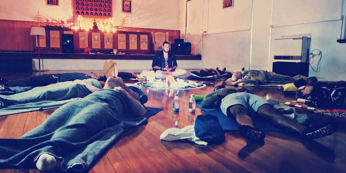Come & Try Breathwork - A Ceremony of Breath - People lying on their backs as a part of the meditation section of this ceremony of breath breathwork session.