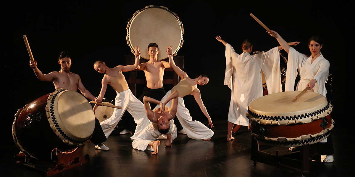 Water Mirror - Dancers and Musicians pose expressively with drums