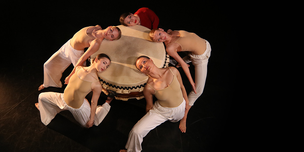 Company artists for a circle around a drum