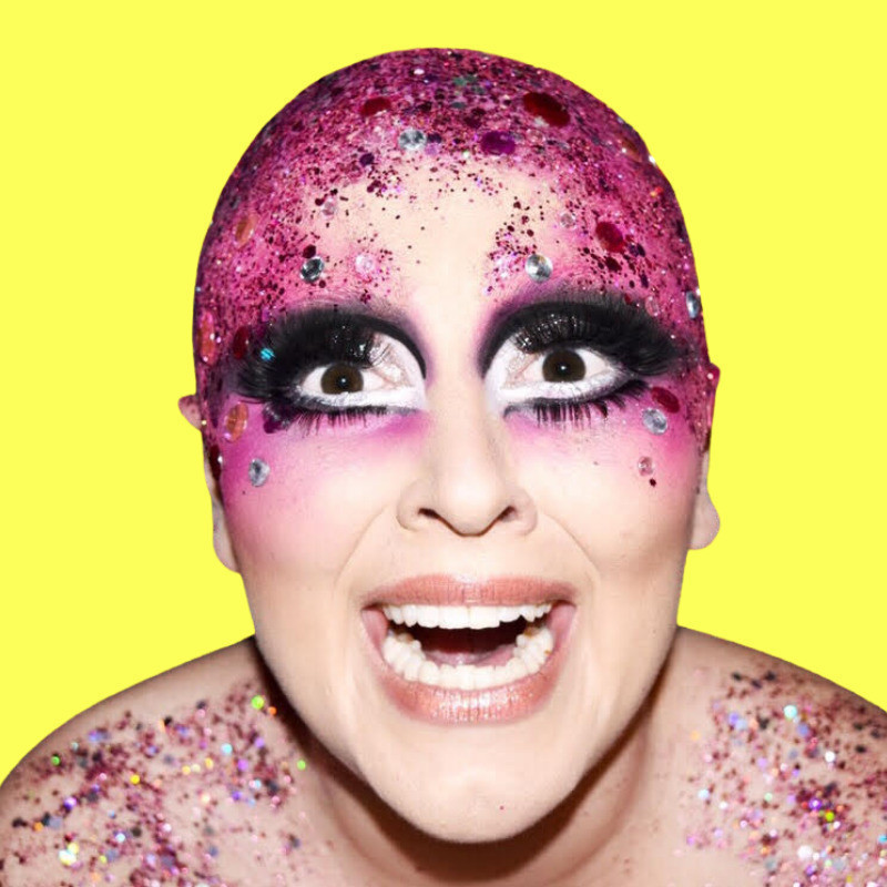 Clare Ellen O'Connor - Plucked! - An AFAB person with dynamic, pink drag make up and a pink bald cap on her head that is covered in glitter. She has an expression on her face that says "Argh! I'm overwhelmed!" Image is placed on a florescent yellow background.