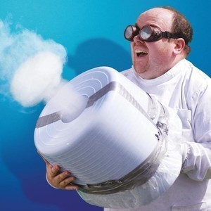 Science Magic: Crazy Gadgets - Man in Lab coat an goggles, firing a homemade smoke cannon while laughing like a mad scientist