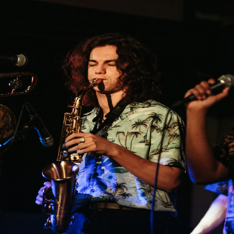 3 members of Malibu Drive in concert, Trombone, Saxophone and Vocalist