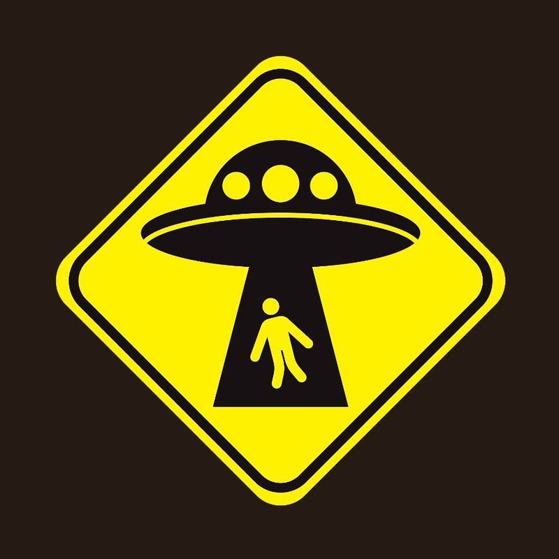 My Favourite Conspiracy - a road sign with a person getting abducted by a ufo