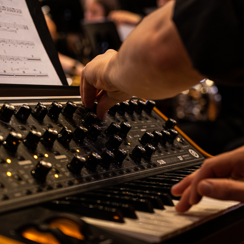 A synthesiser being operated as part of an Adelaide Wind Orchestra performance