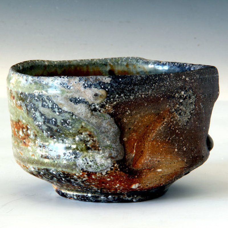 A tea-bowl with multi-coloured glazes and thick textures.
