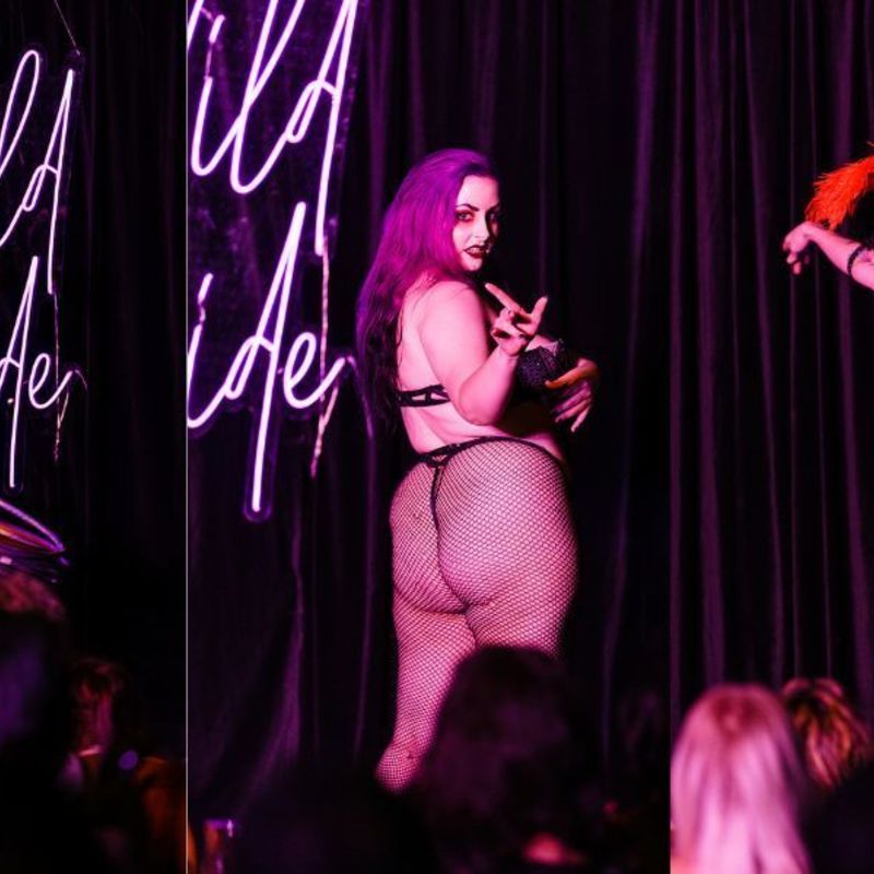 (Left) Hannah Indigo holds up their hand as a stack of hulahoops falls from their waist against a black curtain backdrop with the purple 'Wild Side' sign.
(Centre) Lilith Von Dahlia looks over her shoulder and gestures to audience against a black curtain backdrop with the purple 'Wild Side' sign.
(Right) Sian Brigid wears a black skirt and bodysuit with black and red feathers in a headpiece and steps across stage with her arms out against a black curtain backdrop with the purple 'Wild Side' sign.