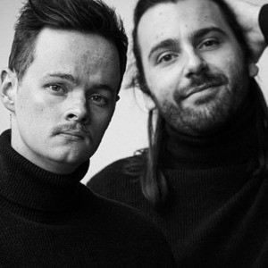 Image of Harry Baulderstone and Marcus Ryan in black and white - a similar fashion to Simon & Garfunkel's 'Bookends' photoshoot.