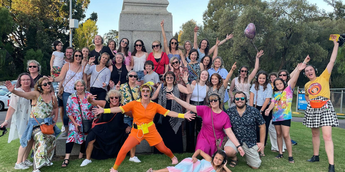 Dico Diddi poses with lots of happy disco people at Lighthorse memorial.