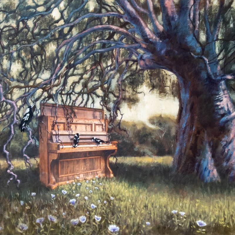 CANCELLED_Murray Bridge Piano Sanctuary Launch Concert - Mixed media art work of piano resting under a gumtree outside, with magpies perching on the instrument.  The work is called 'Catching The Song', created by Malinda-Ro Jenner, Oliver Gerhart and Jan Burns in 2018.