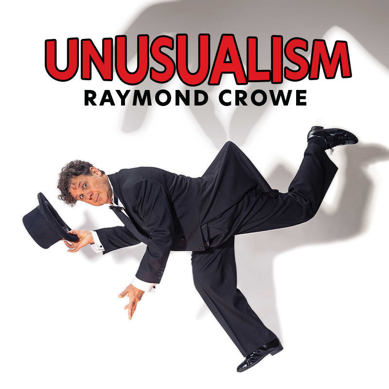 Raymond Crowe wearing black suit and pants, holding his top hat with his right hand on a white background. The title says: Unusualism, Raymond Crowe.