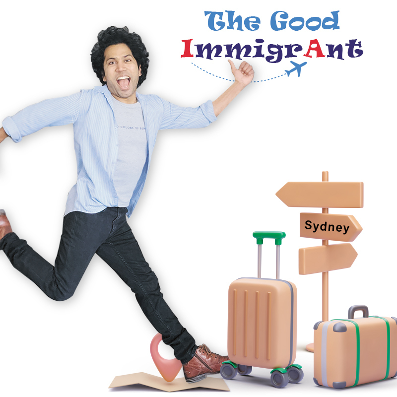 The Good Immigrant - Travelling Bag and a luggage is on the floor. A young man is jumping with joy. The text on top mentions The Good Immigrant.