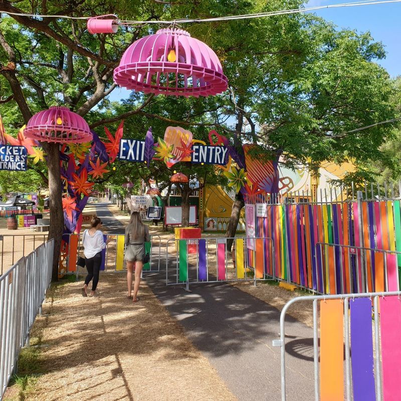 An entrance gate to the Garden of Unearthly Delights is adorned with colourful streamers.