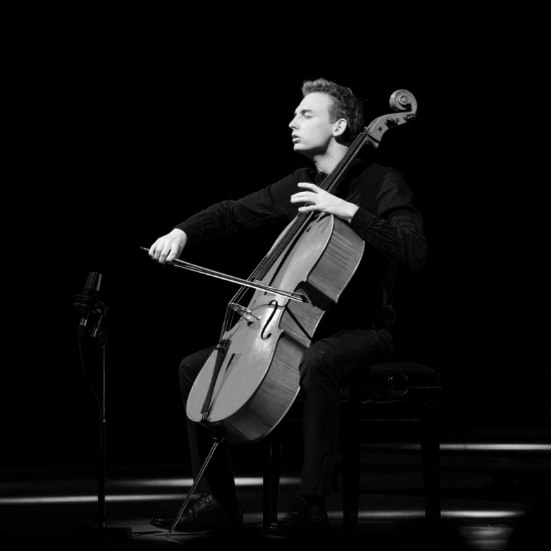 William Jack performing with a cello