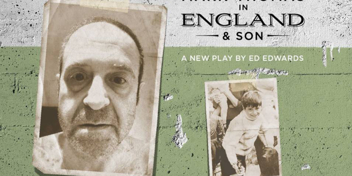 England & Son - An old style black and white photo of the Face of Mark Thomas, a man with an unshaven face and shaved head staring seriously into the camera, stuck on a pale green brick wall.