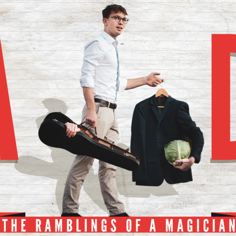 Generic white man with glasses stands next to the words TA DA with violin case, Suit jacket and a cabbage...