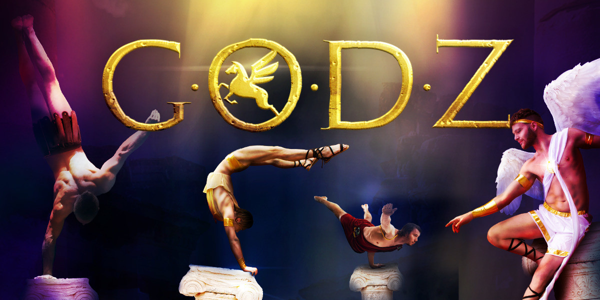 4 greek godz pose acrobatically in the heavens. The words GODZ is shining in gold above them.