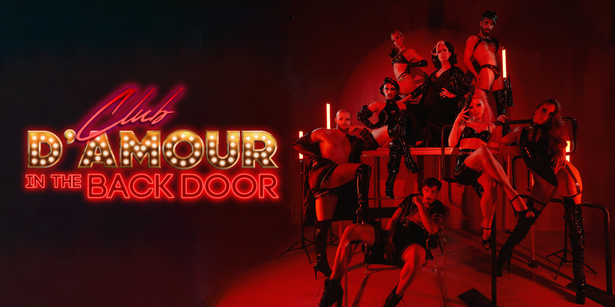 Club D'amour: Back Door - Club D'amour in the Back Door logo. To the right, a bunch of artists pose across scaffolding. They're all in black.