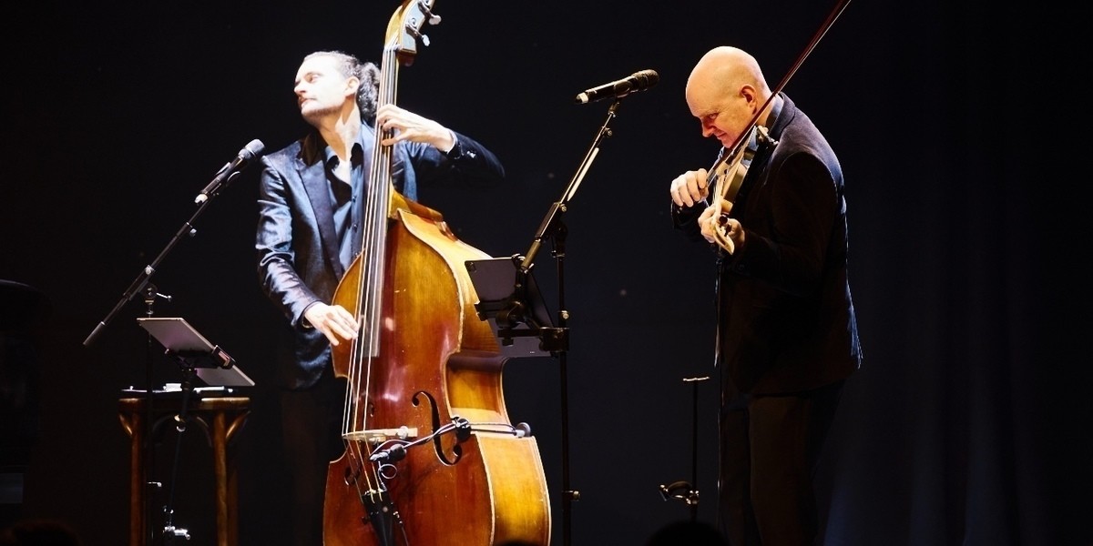 Dylan Paul plays double bass and Julian Ferraretto plays violin