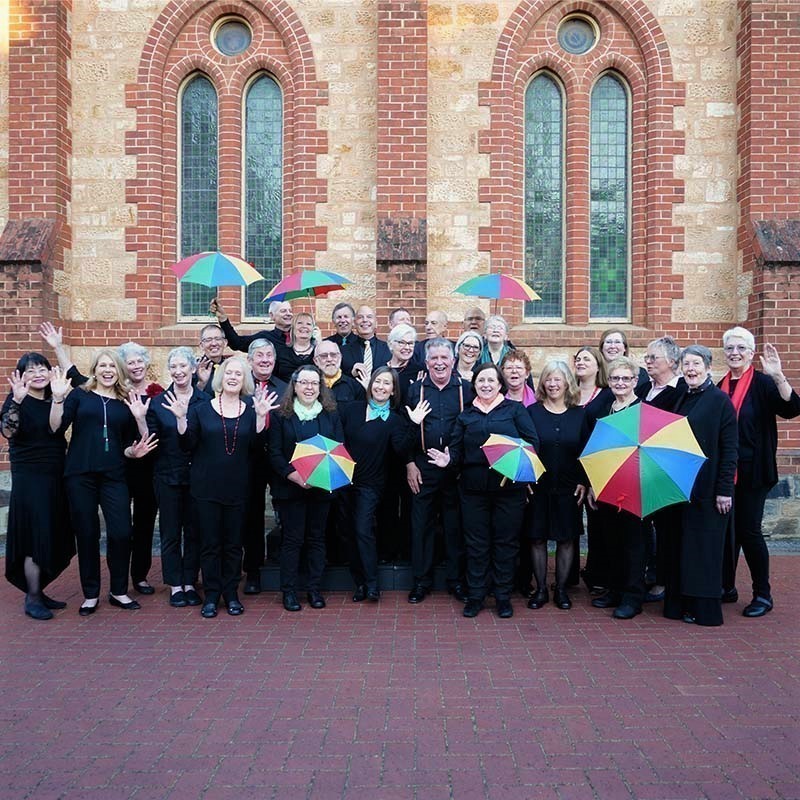 CANCELLED - A Choir Celebrates - The 30 member choir in their concert dress before a rehearsal. Some members are holding umbrellas to signify our name of Umbrella a Cappella. All looking towards the camera.
