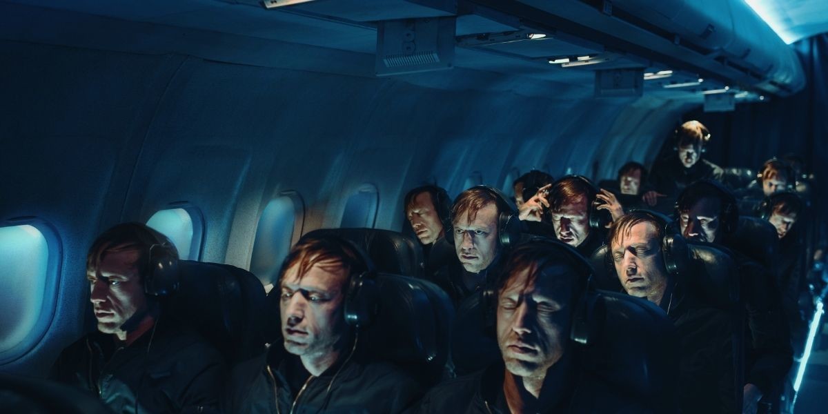 FLIGHT - The interior of FLIGHT shows a plane with the same man in different positions in the different seats.