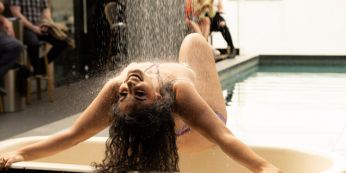 sara martini performing under the shower head at nineteen ten